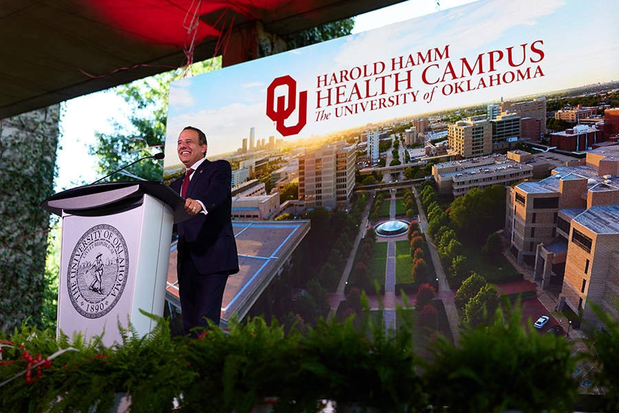 OU President Joseph Harroz Jr standing at a podium.