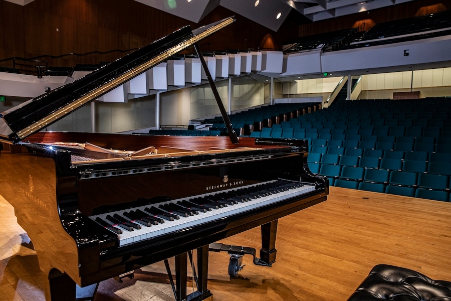 A Steinway piano on a stage. 