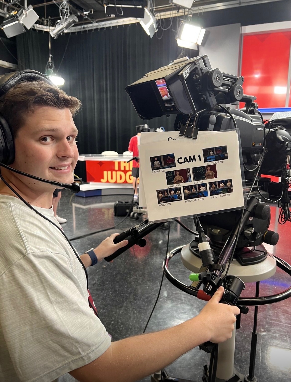 A guy managing a camera.