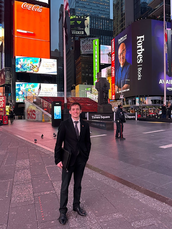 Evan Moros standing in empty New York City Times Square.