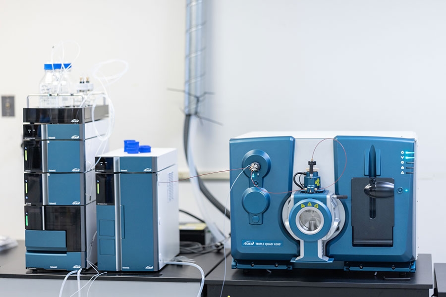 A blue, black and white equipment sits on a surface.