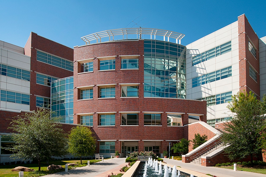 The entrance to the National Weather Center, featuring a water fountain.