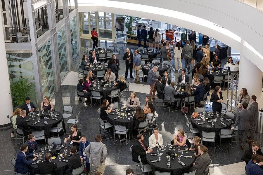 An aerial view of an event taking place in the National Weather Center Auditorium.
