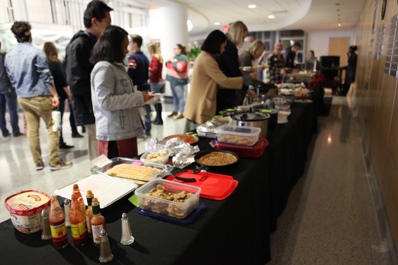 Attendees of the 2020 Multicultural Fest fill their plates with food from all over the world.