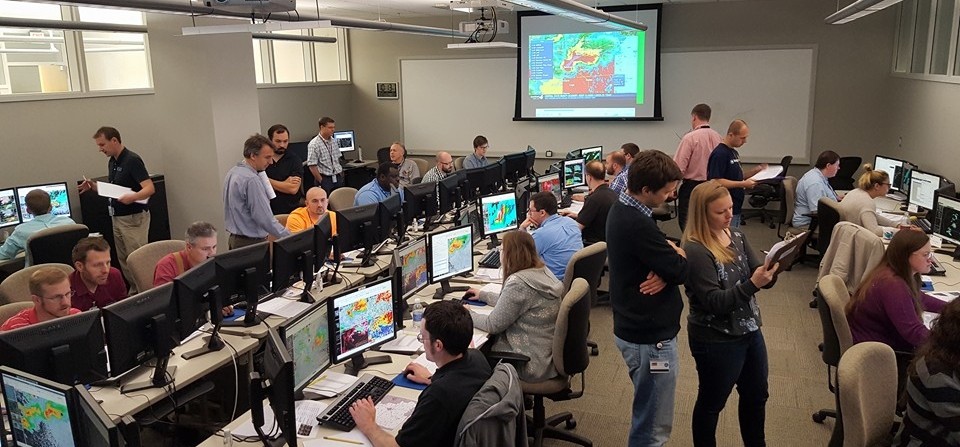 Researchers work on forecasting severe weather in the Warning Decision Training Division Office, located in the National Weather Center.