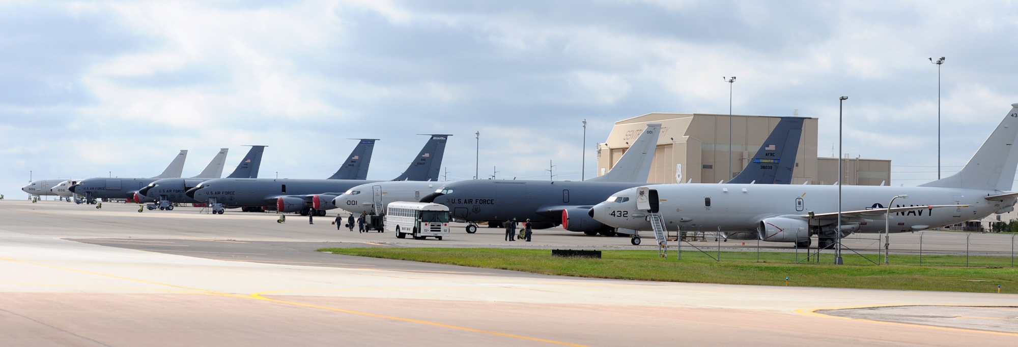   Four Navy P-8 Poseidon aircraft from Naval Air Station Jacksonville, Florida, line up with Air Force KC-135 Stratotankers on Tinker Air Force Base’s flightline. Air Force photo by April McDonald.
