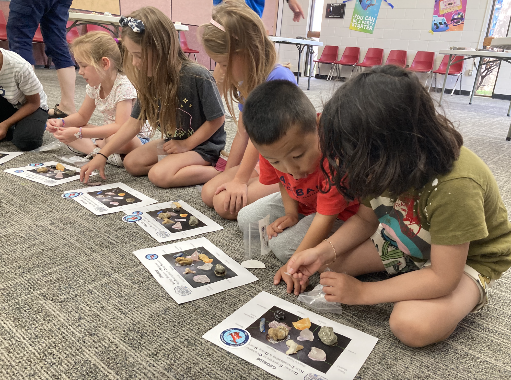 children looking at rocks