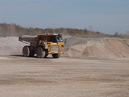 Figure 2. The mine haul trucks delivers the blasted rock to the next station in the mine for processing.