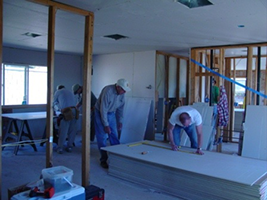 Figure 3. Installing wallboard during construction.