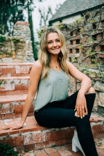 Grace Harris sitting on stairs