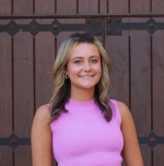 Grace Harris sitting on stairs