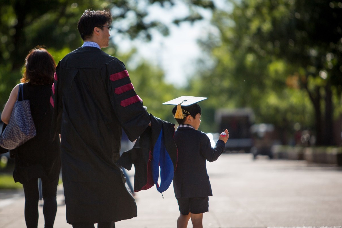 Family in graduation robe and hat