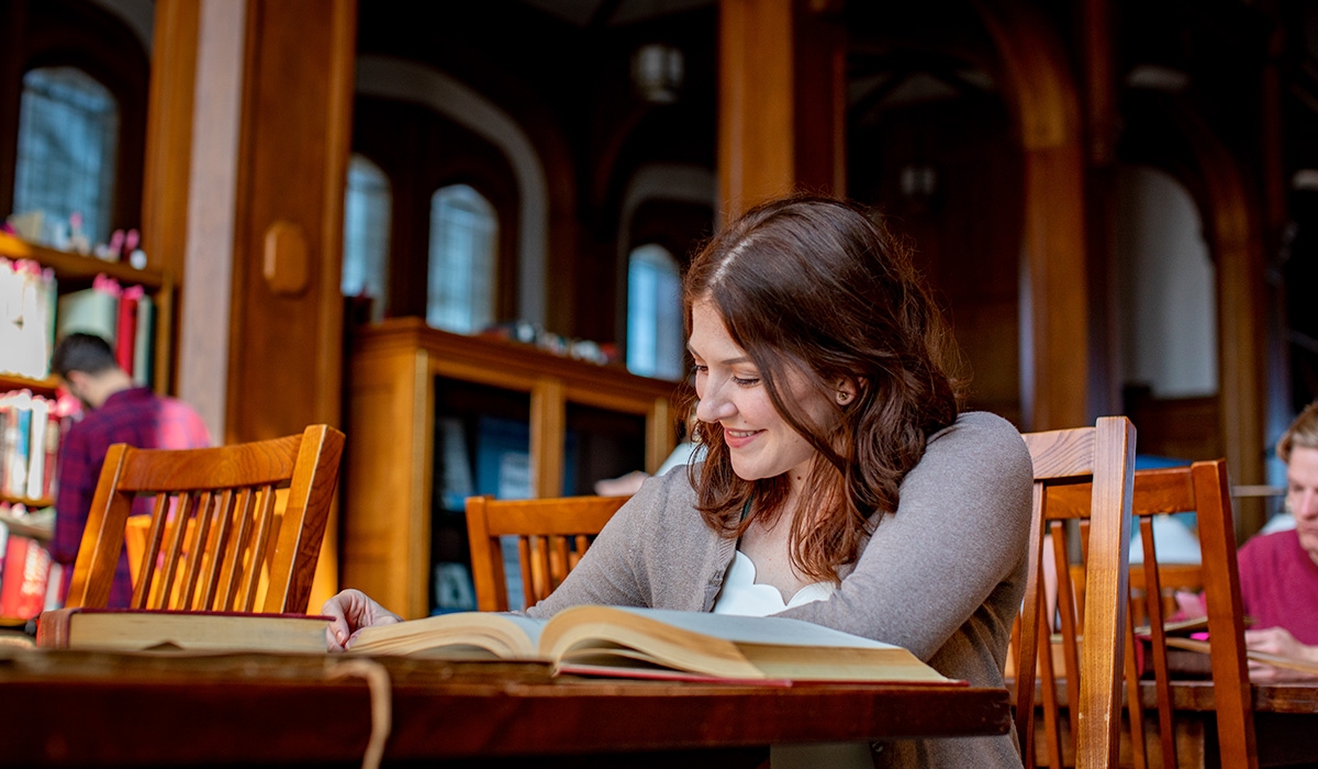 student studying in the Great Reading Room, Bizzell Library