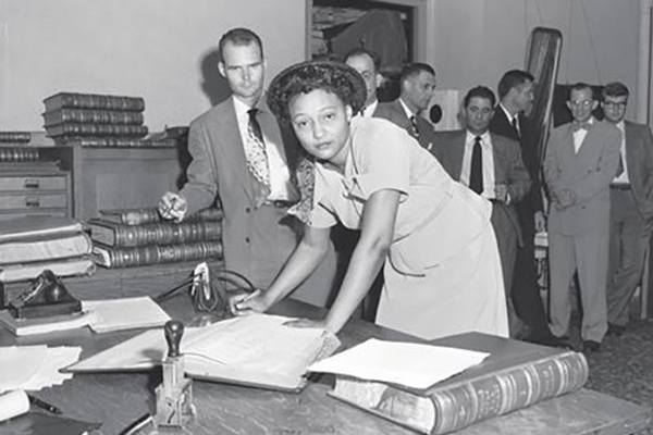 Ada Lois Sipuel Fisher signing the roll of attorneys after passing the Bar Exam.