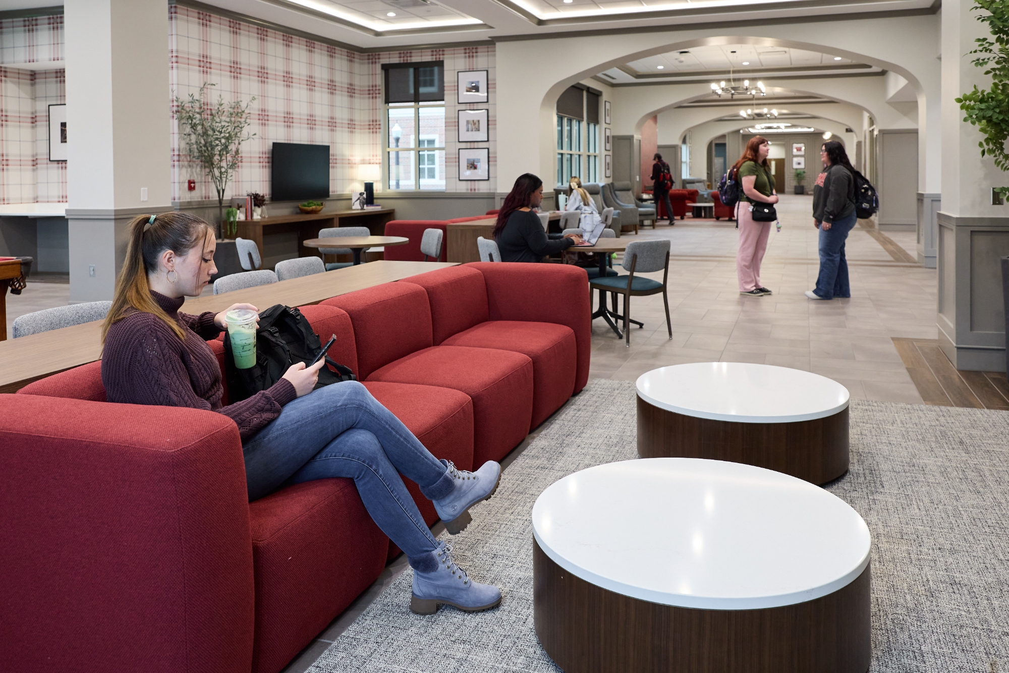 Interior of McCasland Hall with students in a lounge. 