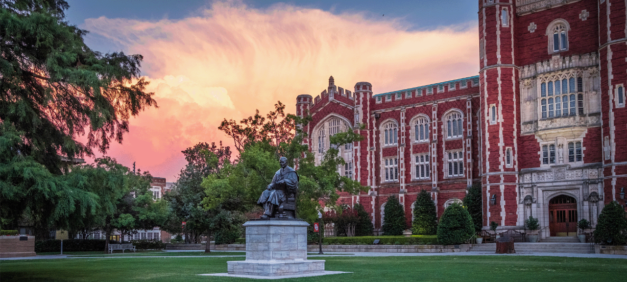 Evans Hall at sunset with clouds on OU's campus in Norman, Oklahoma.