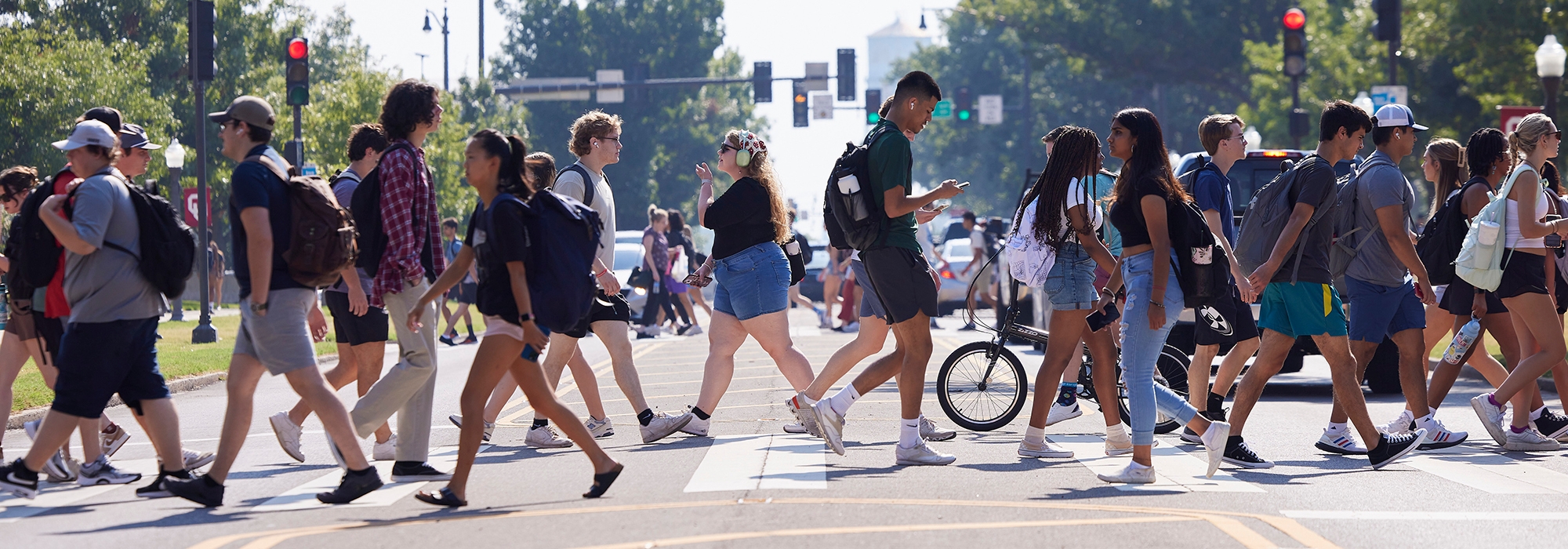 Students walking in crosswalk on campus at the University of Oklahoma.