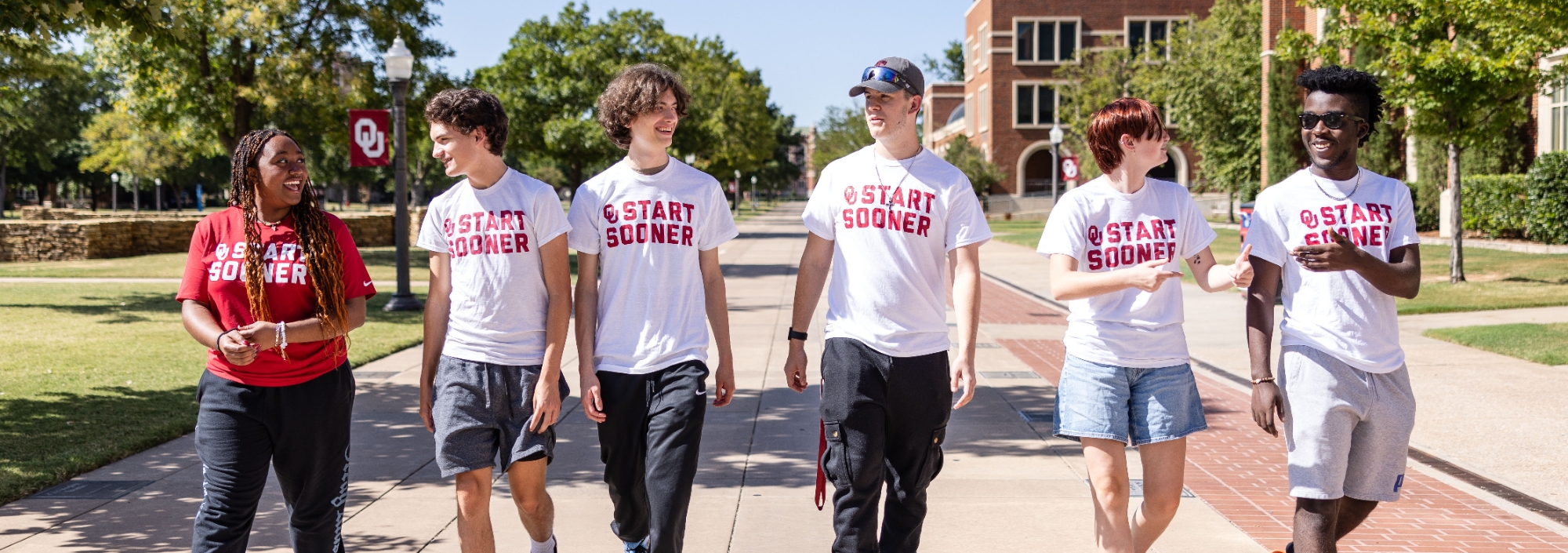 Start Sooner students walking on campus at the University of Oklahoma.