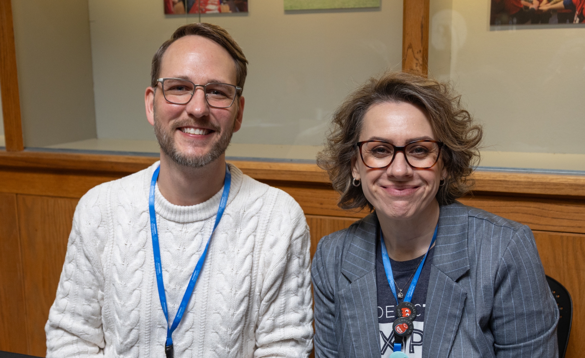 Two people smiling at the camera.
