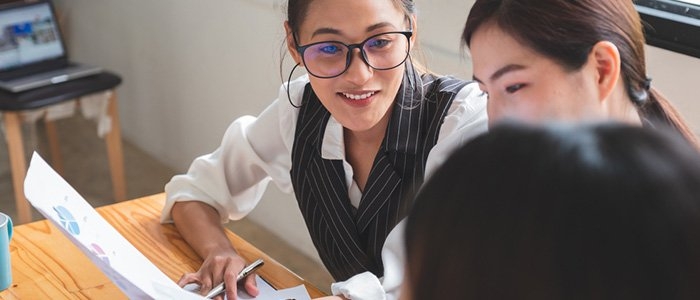 three co-workers discussing a project