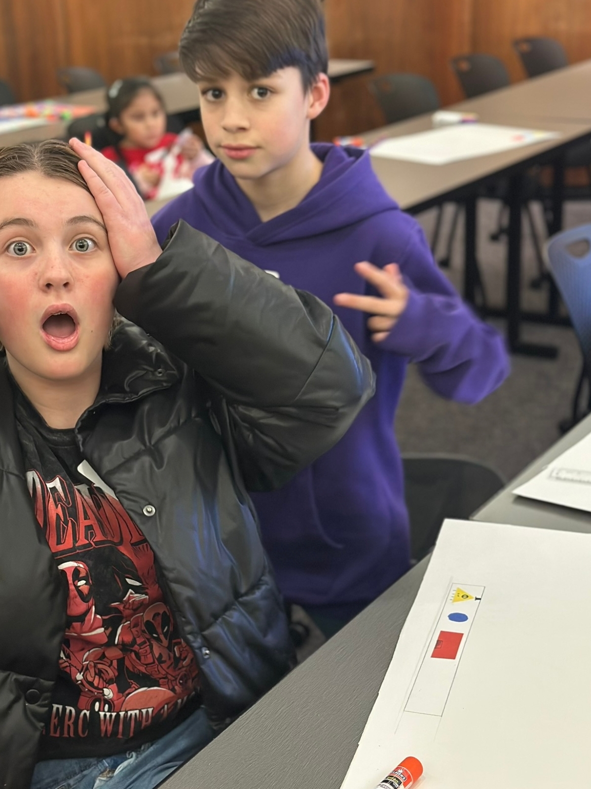 students standing outside with staff by a truck