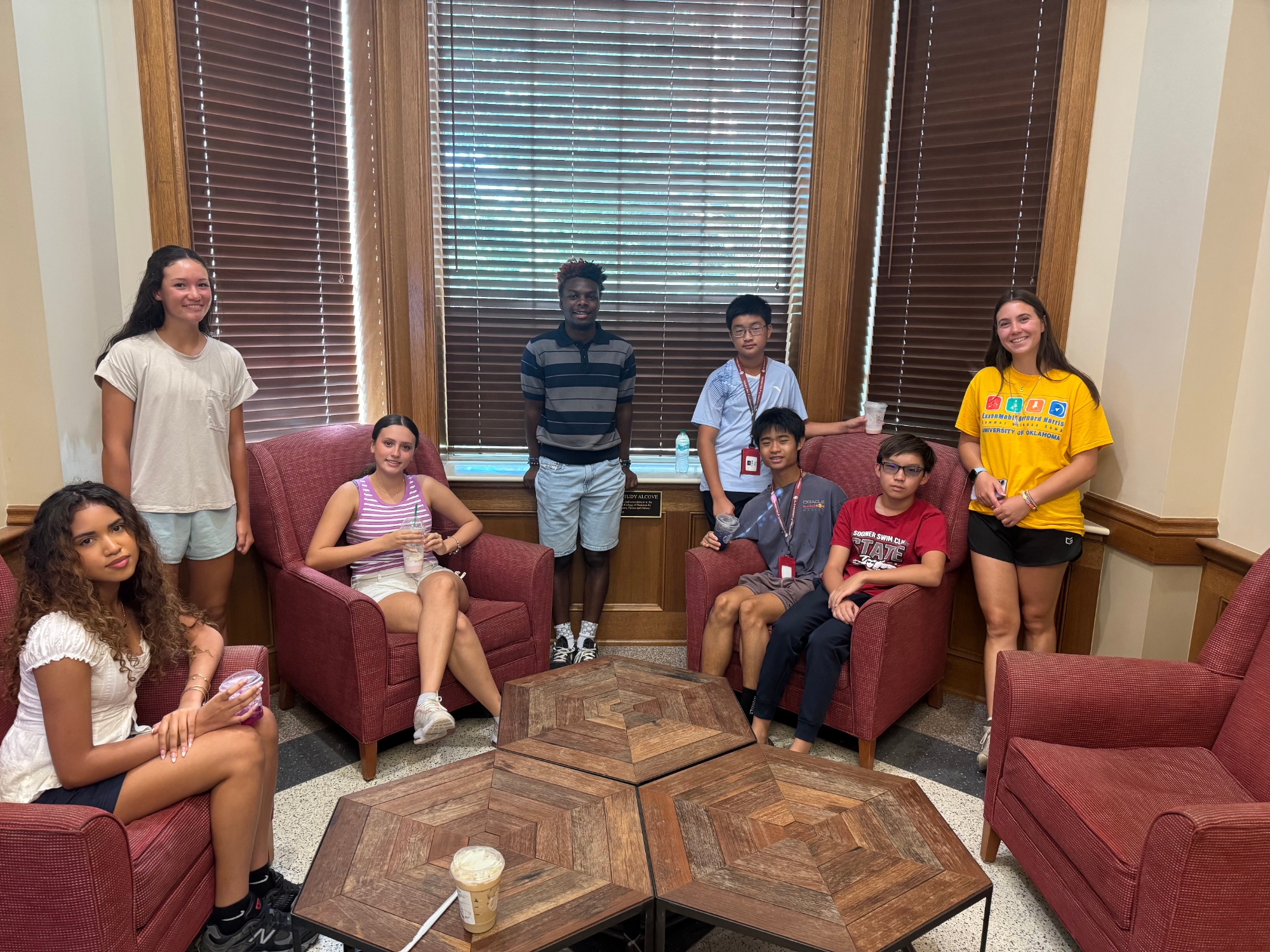 Students posing for a photo with a counselor in Price College