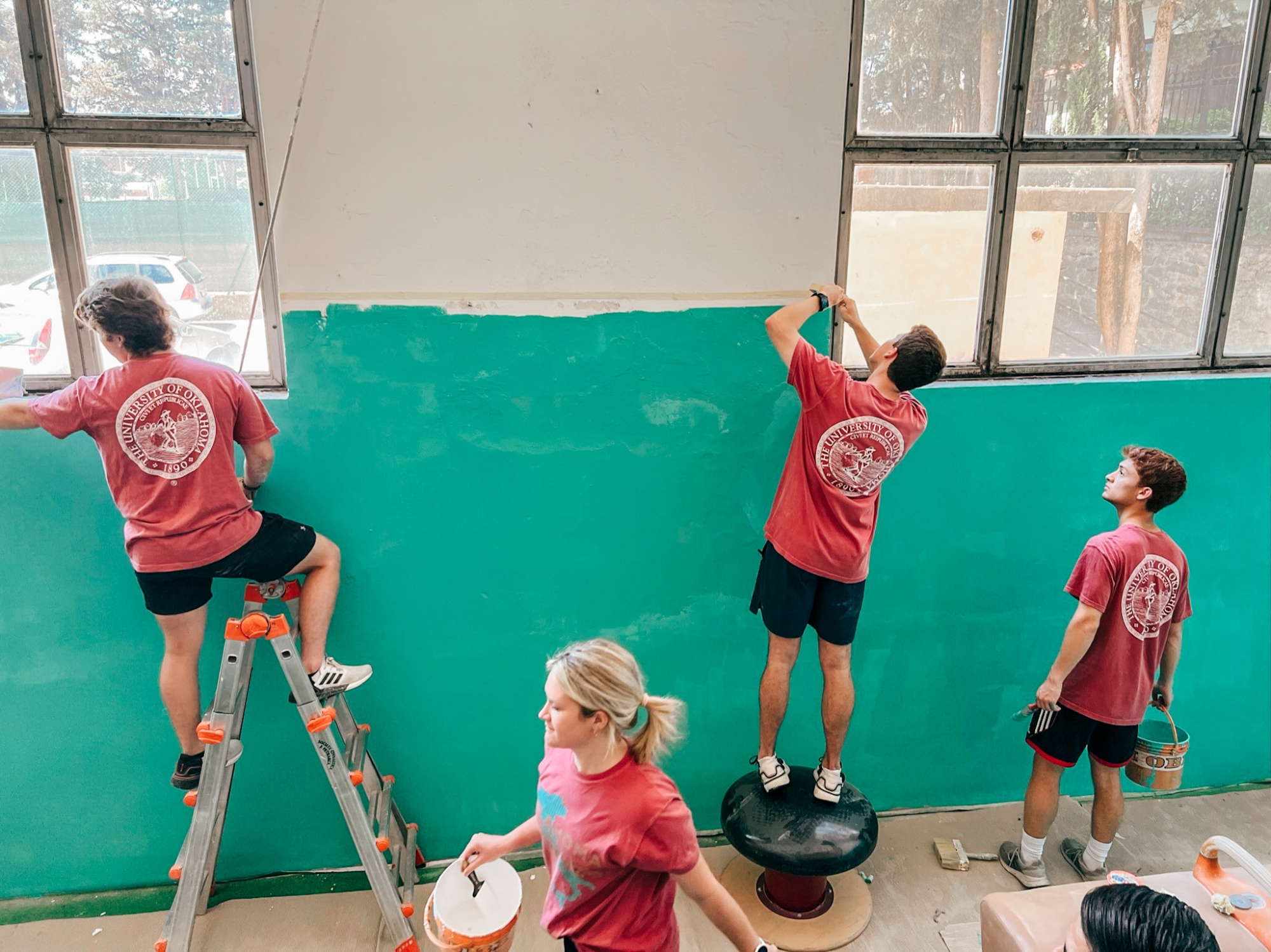 PCS students restoring a historic gym in Arezzo, Italy for the yearly service project abroad.