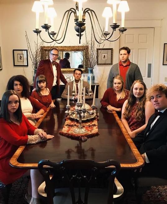 PLC students group photo at a murder mystery dinner.