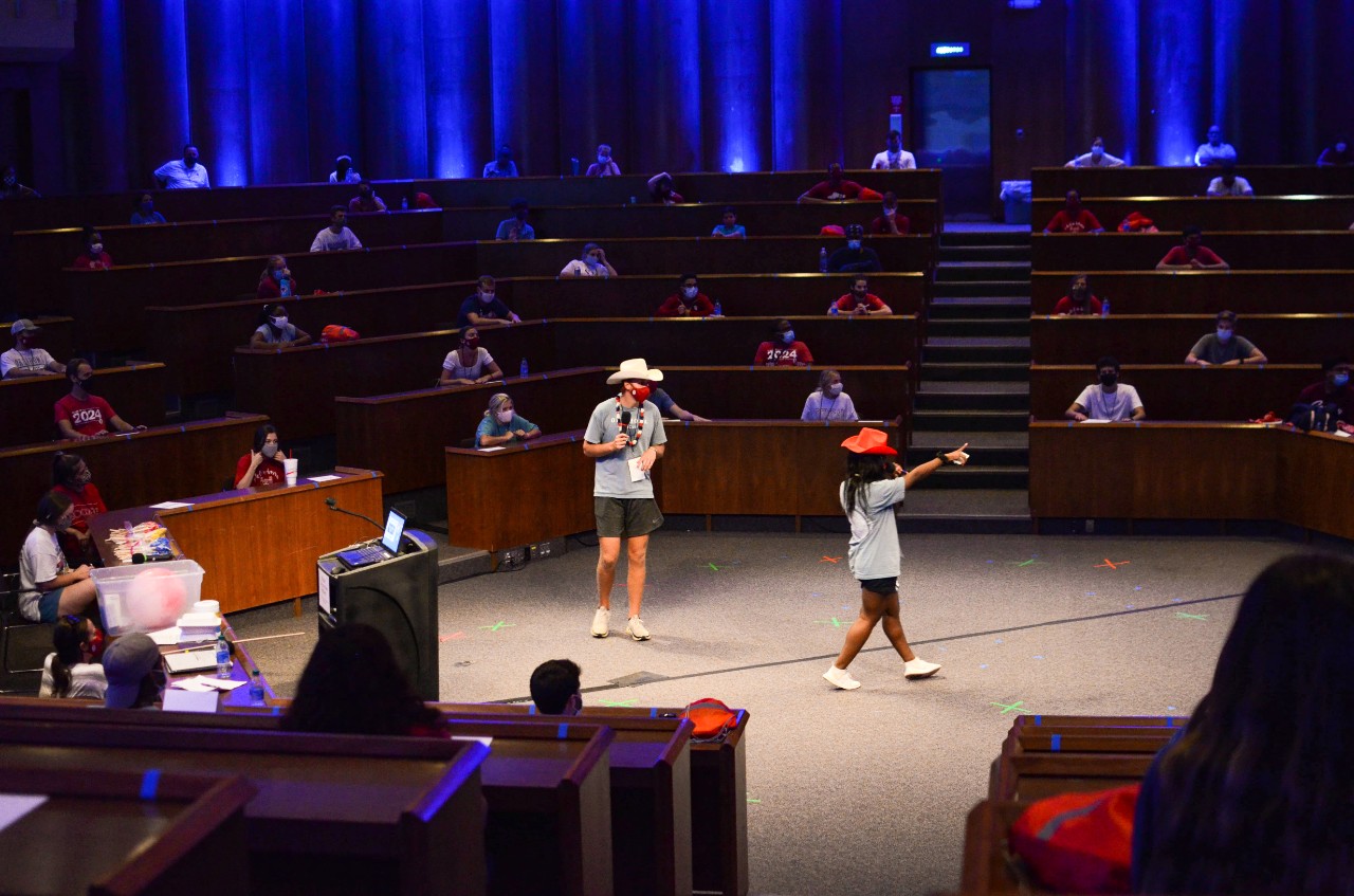 PLC Advisors welcoming the new PLC 60 class in the forum wearing masks in response to the pandemic. 