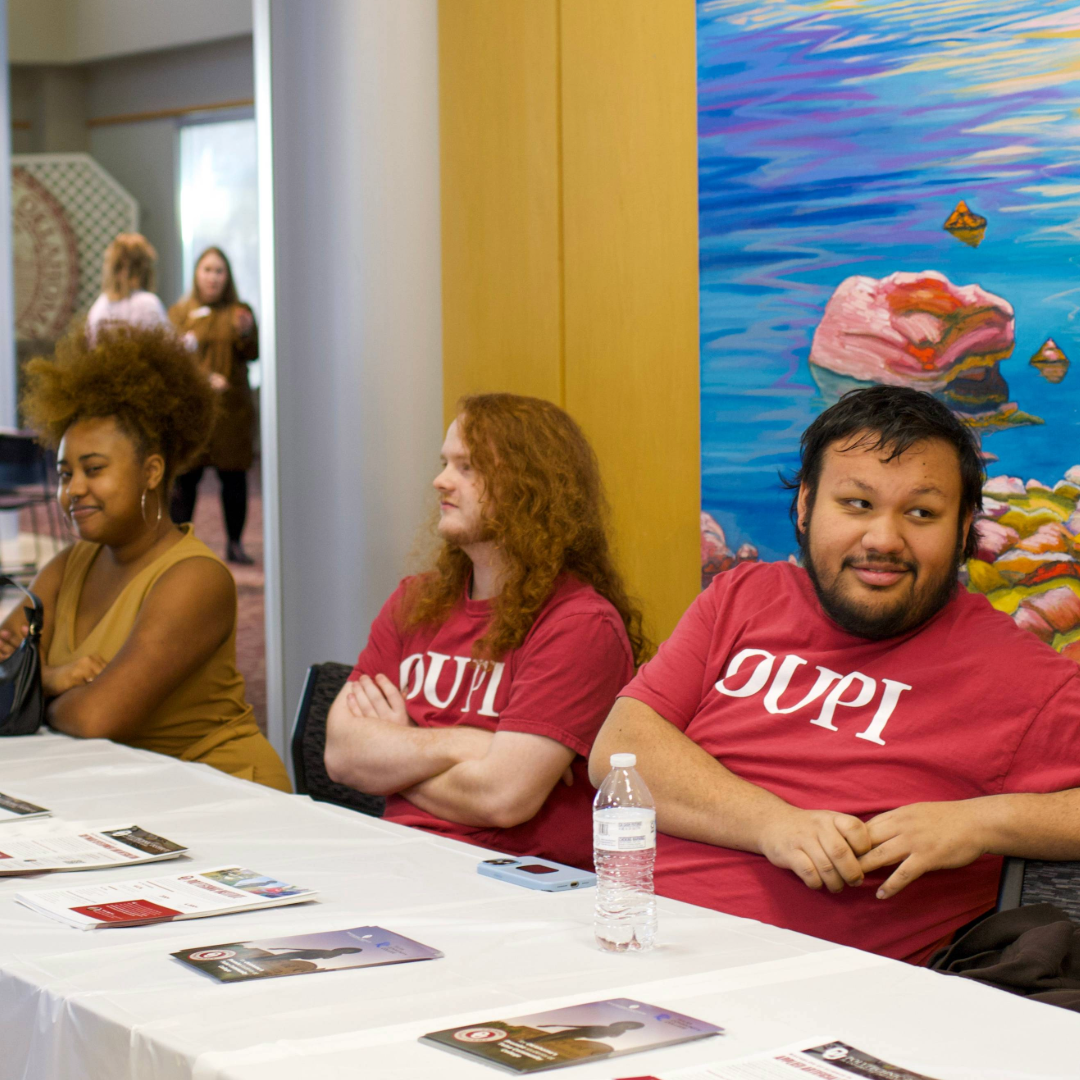 OUPI students waiting to greet guests at an event.