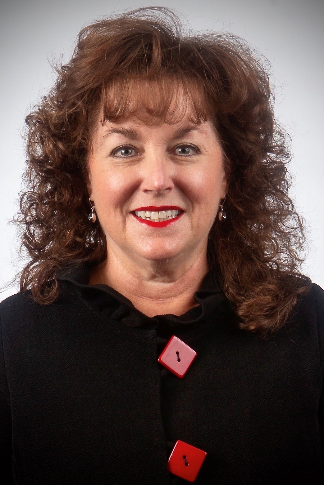 A photo of Teri Reed on a light colored background