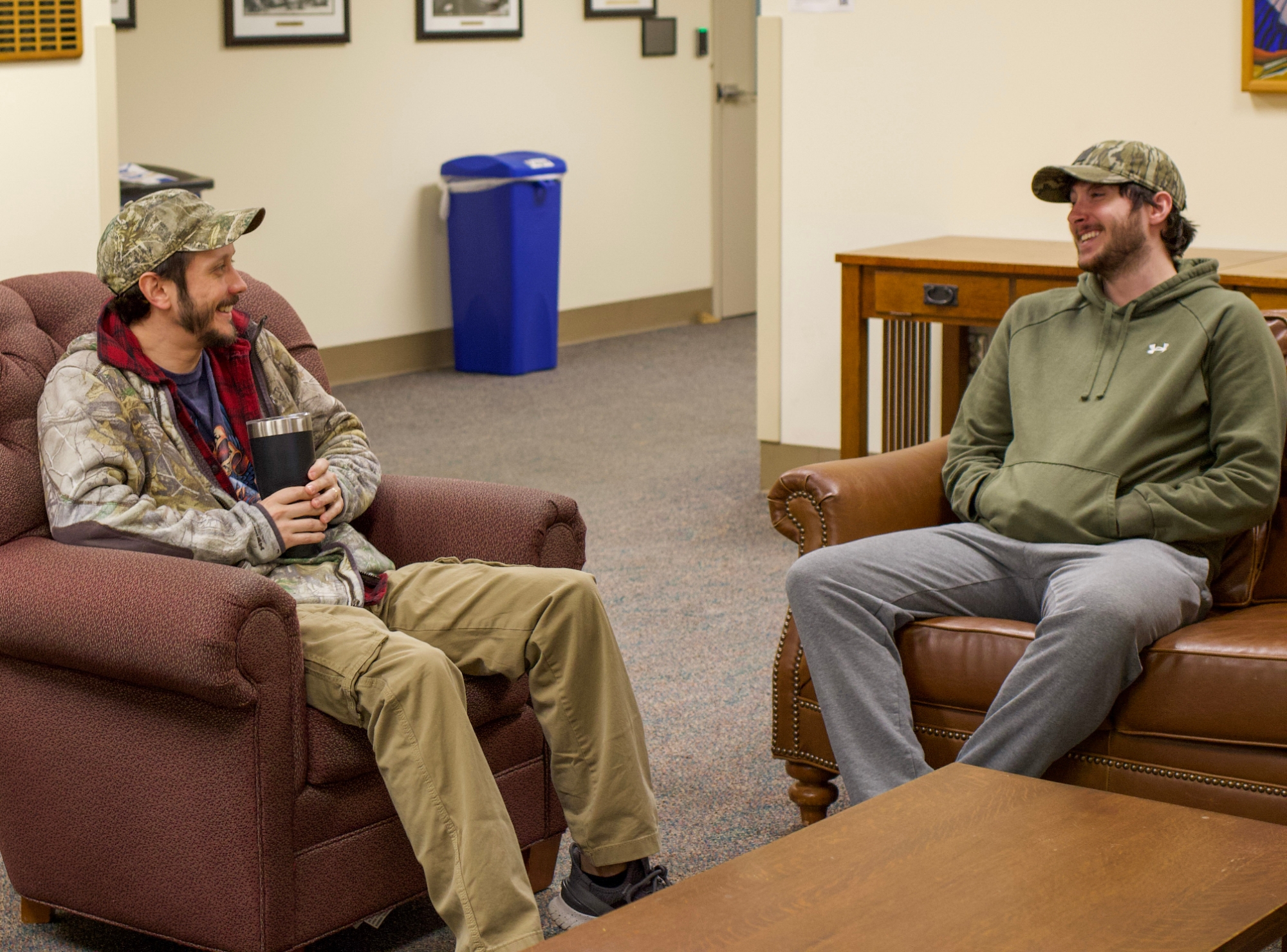 Two students sitting and talking.