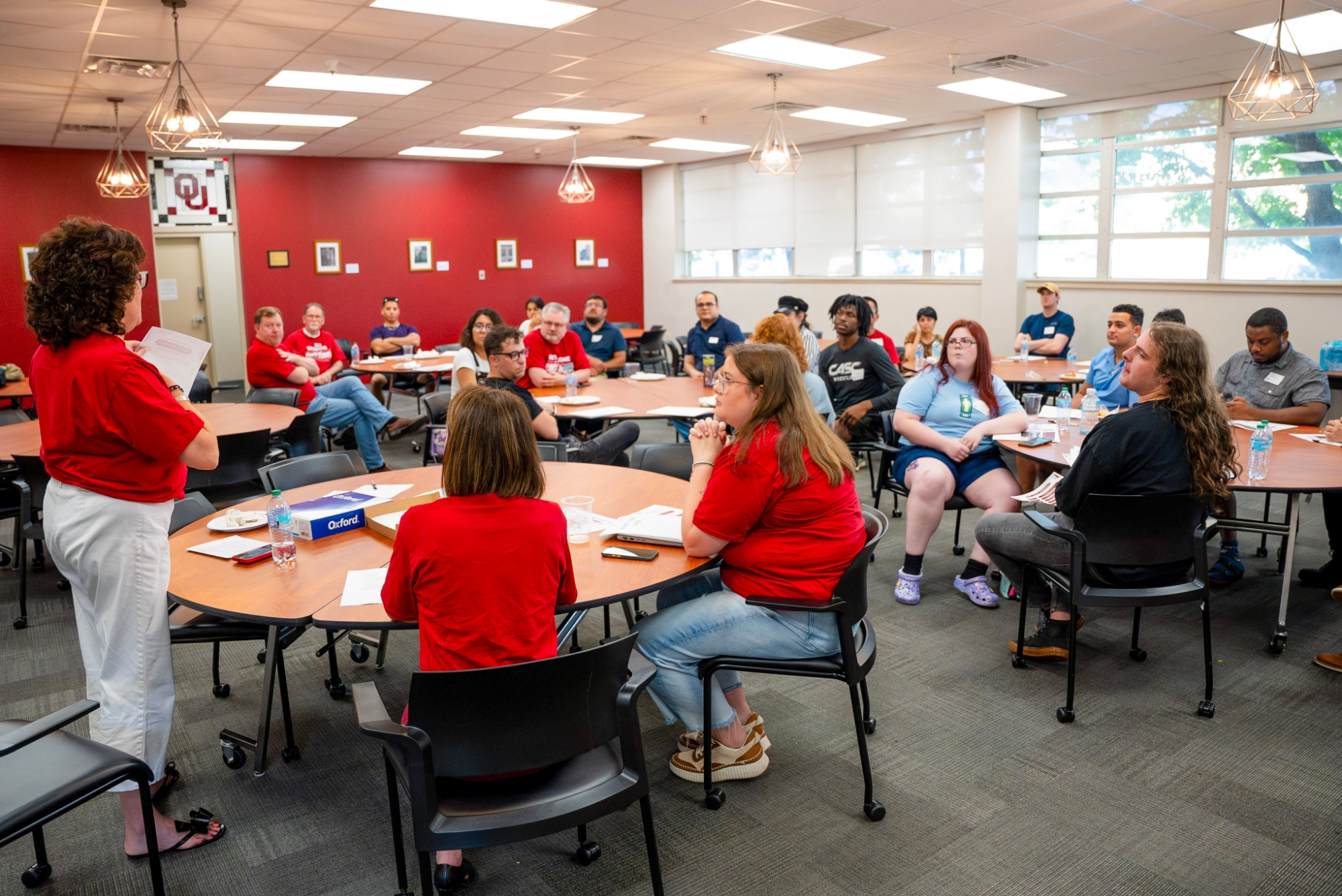 A group of students looking at a speaker.