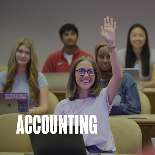 Dean Phelps and a student having a conversation as they walk through the halls of Price College. Text over the photo reads: Accounting.