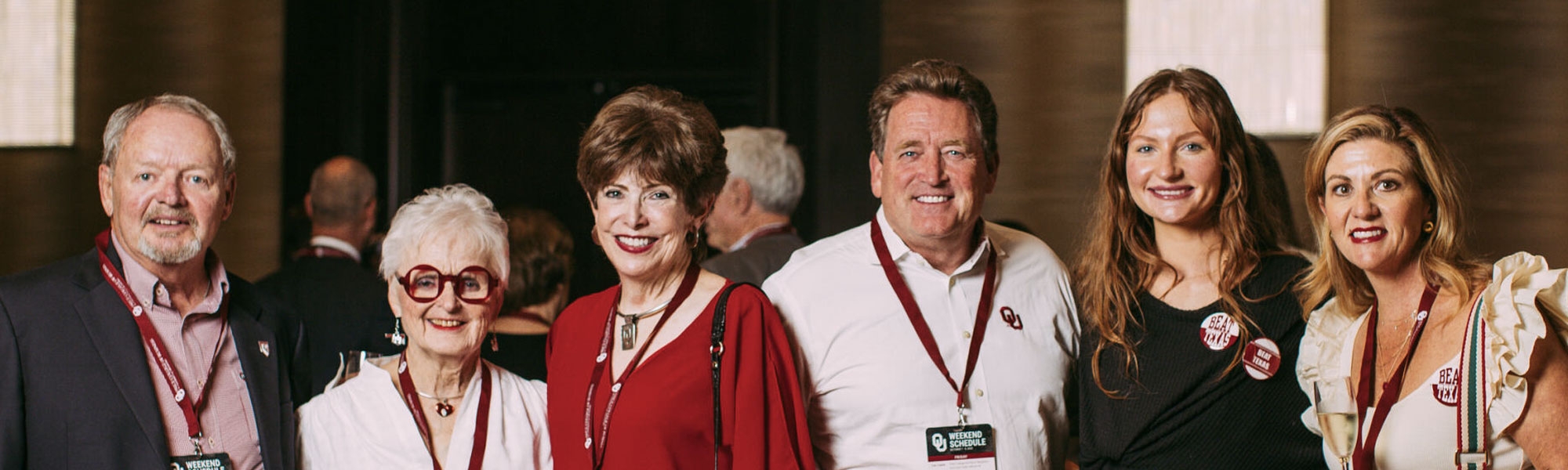 A group of many different generations of OU alumni celebrate together during an OU event.