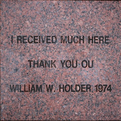 engraved stone paver reads:  I received much here, thank you OU. William H. Holder 1974