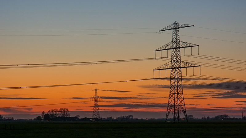 power lines with sunset behind