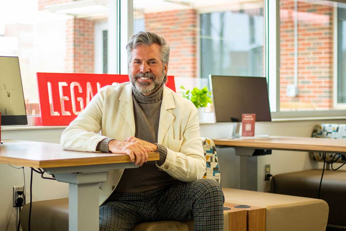 David Kinsinger sitting at a table in the Entrepreneurial Law Center.