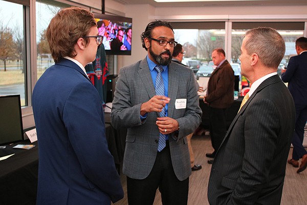Businessmen network with one another at OU Entrepreneurship Expo