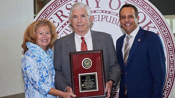 Frank Hill receiving the OU Regents Alumni Award with Regent Natalie Shirley and OU President Harroz.