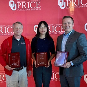 From left, Joe Dulin, Ling Zhang and Devin Williams stand with their awards at the Price College Faculty and Staff Awards in April 2023