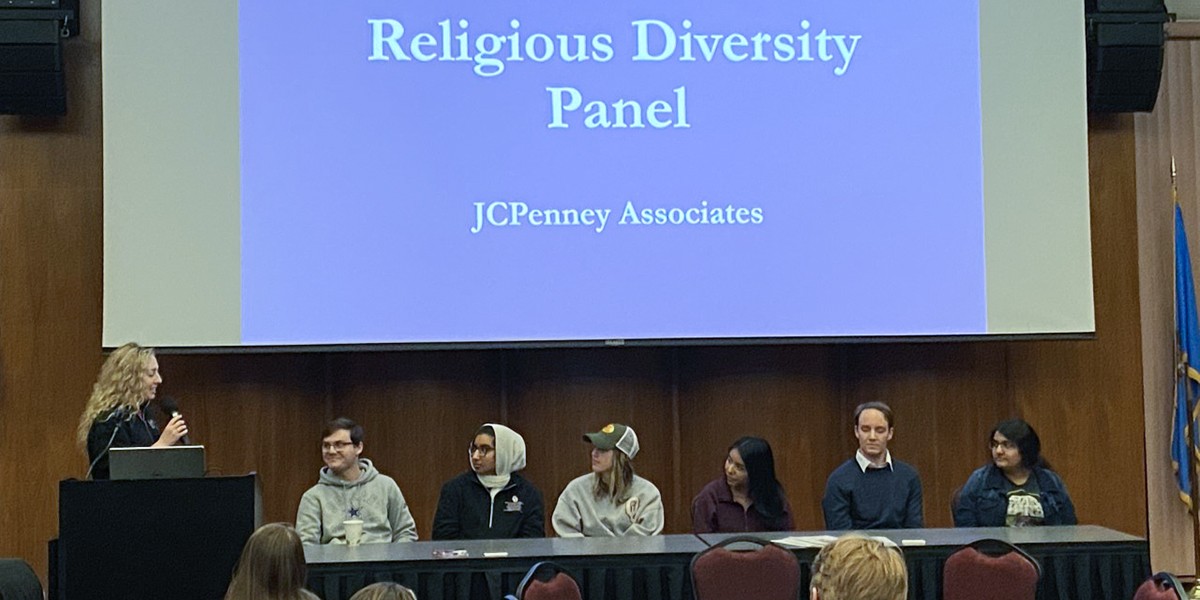students listen to speaker at religious diversity panel