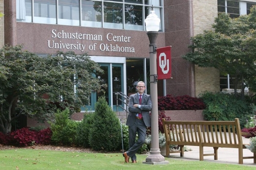 Corey Phelps, Dean of Price College of Business stands outside the Schusterman Center at the OU Tulsa campus. 