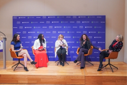 Breea Clark sits on stage with the panelists from the Womens Forum USA in Washington, D.C.