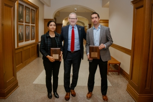 Dean Corey Phelps stand with the McLaughlin Prize winners as they display their awards
