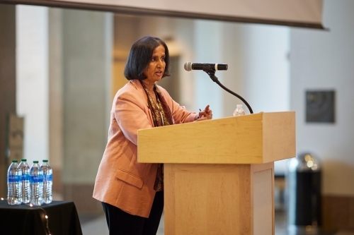 Radhika Santhanam, MIS professor speaks at podium during an event.