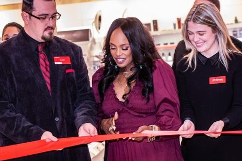 Nyakio Grieco cuts the ribbon with two JCPenney store employees in Oklahoma City, OK.