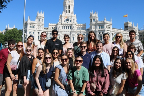 Study abroad students gather together for a group photo