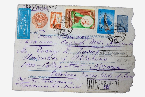 An envelope with many international postmarks and handwriting 