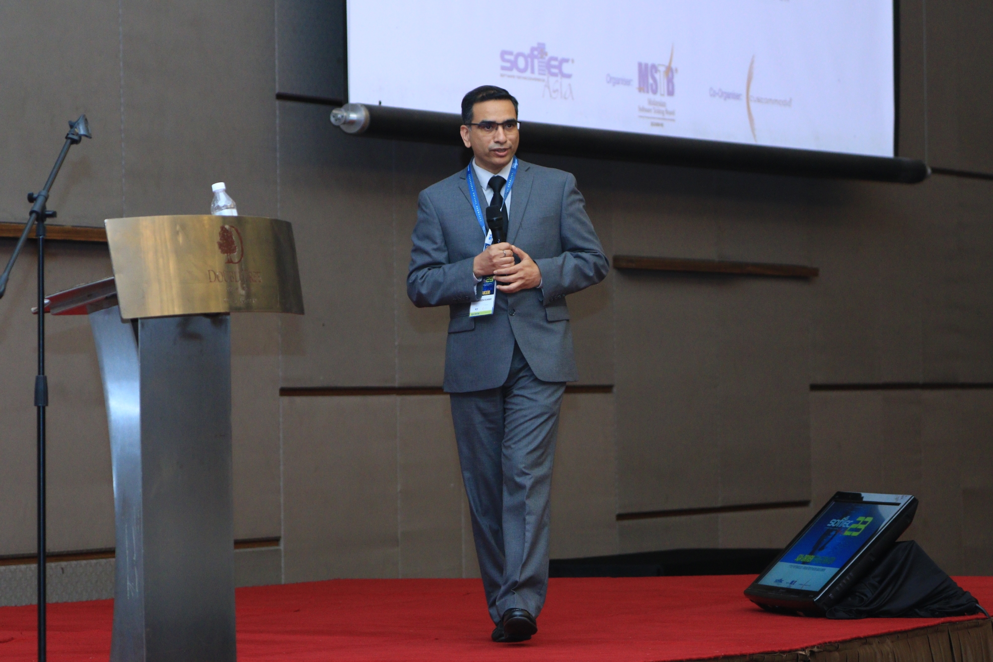Naveen Kumar speaks at the SOFTECAsia 2023 conference in Malaysia.